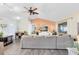 Spacious living room with vaulted ceilings, hardwood floors, ceiling fan, and access to other rooms at 2101 Lake Francis Dr, Apopka, FL 32712