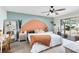 Bright main bedroom with a unique accent wall and sliding glass doors to the yard at 2101 Lake Francis Dr, Apopka, FL 32712
