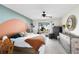 Bright main bedroom with decorative furniture and sliding glass doors to the yard at 2101 Lake Francis Dr, Apopka, FL 32712