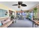 Spacious sunroom featuring plenty of seating and lots of lush plants at 2101 Lake Francis Dr, Apopka, FL 32712