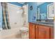 Bathroom featuring a tub/shower combination, tile floors, and a vanity with black countertop at 2326 Wintermere Pointe Dr, Winter Garden, FL 34787