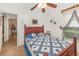 This bedroom offers a comfortable bed and window providing natural light, creating a cozy and inviting personal space at 2326 Wintermere Pointe Dr, Winter Garden, FL 34787
