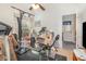 A cluttered bedroom includes exercise equipment and a window, offering a view into a space requiring organization and design potential at 2326 Wintermere Pointe Dr, Winter Garden, FL 34787