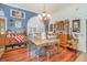 Charming dining room features a chandelier and wood floors at 2326 Wintermere Pointe Dr, Winter Garden, FL 34787
