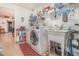 Functional laundry room featuring tile floors, washer, dryer, and utility sink at 2326 Wintermere Pointe Dr, Winter Garden, FL 34787