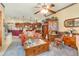 Open-concept living space with kitchen views, wooden furniture, and cozy furniture at 2326 Wintermere Pointe Dr, Winter Garden, FL 34787