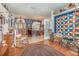 Inviting living room featuring wood floors, a quilt, and an open layout at 2326 Wintermere Pointe Dr, Winter Garden, FL 34787