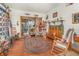 Cozy living room with rustic decor, wood floors, and plenty of natural light at 2326 Wintermere Pointe Dr, Winter Garden, FL 34787