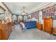 Comfortable main bedroom with blue accents, a ceiling fan, and ample closet space at 2326 Wintermere Pointe Dr, Winter Garden, FL 34787