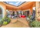 The patio features neutral concrete, ceiling fans, potted plants and access to the home's interior through sliding glass doors at 2326 Wintermere Pointe Dr, Winter Garden, FL 34787