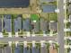 An aerial view showcases the home's solar panels, backyard, and surrounding neighborhood at 2949 Marlberry Ln, Clermont, FL 34714