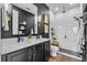 Modern bathroom featuring double sinks, ship lap accent wall, and a glass shower at 2949 Marlberry Ln, Clermont, FL 34714
