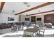 Well-designed common area with tables, chairs, bar seating, multiple televisions, and comfortable sofas at 2949 Marlberry Ln, Clermont, FL 34714
