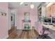 Home office featuring custom shelving, modern decor, and a comfortable workspace at 2949 Marlberry Ln, Clermont, FL 34714