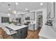 Modern kitchen with stainless steel appliances, a spacious island, and stylish pendant lighting at 2949 Marlberry Ln, Clermont, FL 34714