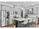Stylish kitchen featuring stainless steel appliances, granite countertops, and ample cabinet space at 2949 Marlberry Ln, Clermont, FL 34714