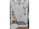 Modern shower with white subway tiles, black hardware, and a bench at 2949 Marlberry Ln, Clermont, FL 34714