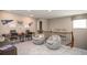 Upstairs bonus room with a study space, seating, and carpeted floors at 3848 Bluethread Way, Poinciana, FL 34759