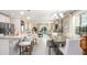Open-concept kitchen and dining area featuring modern lighting and an adjacent living area at 3226 Viceroy Ct, Poinciana, FL 34759