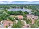 Overhead view showing the placement of the home with the nearby lake and neighborhood at 3414 Cocard Ct, Windermere, FL 34786