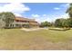 Expansive backyard featuring a large in-ground pool and lush landscaping at 3414 Cocard Ct, Windermere, FL 34786