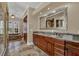 Large bathroom featuring double sink vanity and granite counters and tile floors at 3414 Cocard Ct, Windermere, FL 34786