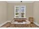A luxurious bathroom features a tiled soaking tub and a sunlit window view at 3414 Cocard Ct, Windermere, FL 34786