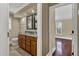 Bathroom featuring double sinks and wood cabinets at 3414 Cocard Ct, Windermere, FL 34786