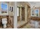 Bathroom featuring glass enclosed shower and soaking tub with jacuzzi jets at 3414 Cocard Ct, Windermere, FL 34786
