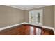 Bedroom with beautiful hardwood floors and french doors to the outside at 3414 Cocard Ct, Windermere, FL 34786