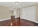 Bedroom showing arched doorway, wood floors, closet doors and trim throughout the room at 3414 Cocard Ct, Windermere, FL 34786