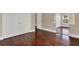Bedroom featuring wood floors, large closet doors, and trim throughout the room at 3414 Cocard Ct, Windermere, FL 34786