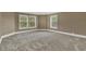 Spacious bedroom featuring neutral carpet, white trim and baseboards, with lots of natural light at 3414 Cocard Ct, Windermere, FL 34786