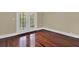 Bedroom with beautiful wood floors and a glass paned door leading to a balcony at 3414 Cocard Ct, Windermere, FL 34786