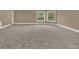 Large bonus room with neutral carpet, base trim, and good lighting at 3414 Cocard Ct, Windermere, FL 34786