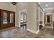 Elegant foyer with tile flooring and intricate glass front door at 3414 Cocard Ct, Windermere, FL 34786