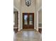 Elegant foyer with ornate double doors and decorative chandelier at 3414 Cocard Ct, Windermere, FL 34786