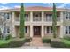 Detailed view of the home's entry showing a brick walkway and stately architectural features at 3414 Cocard Ct, Windermere, FL 34786