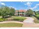 Expansive front lawn and curved driveway leading up to the house at 3414 Cocard Ct, Windermere, FL 34786