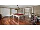Game room featuring a pool table, wood floors, a drum set, and staircase access at 3414 Cocard Ct, Windermere, FL 34786