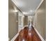 Hallway featuring hardwood floors and neutral paint at 3414 Cocard Ct, Windermere, FL 34786