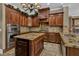 Gourmet kitchen features stainless steel appliances, granite countertops, a center island, and custom cabinetry at 3414 Cocard Ct, Windermere, FL 34786