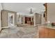Open-concept living room featuring stone tile floors, a neutral color palette, and natural lighting at 3414 Cocard Ct, Windermere, FL 34786