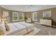 The main bedroom features three large windows, neutral decor, and plenty of space at 3414 Cocard Ct, Windermere, FL 34786