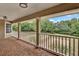 A view from the porch overlooking a manicured lawn and pool at 3414 Cocard Ct, Windermere, FL 34786