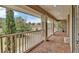 Lovely porch with brick pavers and column details overlooking the manicured front yard at 3414 Cocard Ct, Windermere, FL 34786