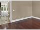 Spacious room featuring hardwood floors leading to the outside and a stone tile entry at 3414 Cocard Ct, Windermere, FL 34786