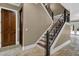 Staircase features iron decorative railings and a door leading to the wine cellar at 3414 Cocard Ct, Windermere, FL 34786