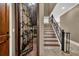 View of the wine cellar and the stairs to the upper level at 3414 Cocard Ct, Windermere, FL 34786