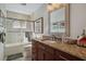 Bathroom featuring a glass shower enclosure and granite counters at 3430 Laurel Dr, Mount Dora, FL 32757